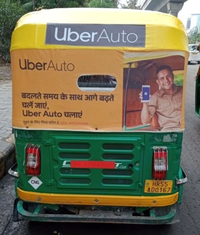 Auto Advertising Service displaying Auto branding on auto rickshaw for app awareness