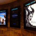 Cinema advertising display on big screen before movie starts, engaging audience with impactful brand message