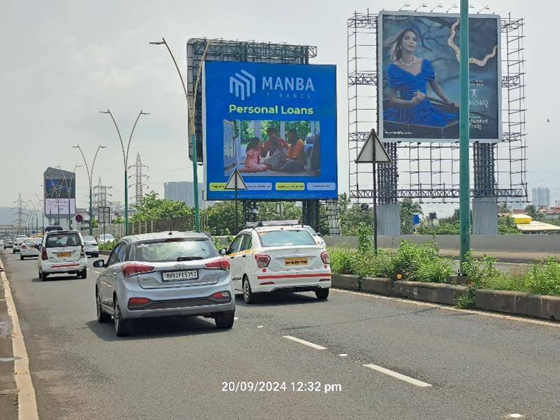 Street view of branded displays by leading Pole Kiosk Advertising Companies in Mumbai on a busy urban road with consistent foot and vehicle traffic Street view of branded displays by leading Pole Kiosk Advertising Companies in Mumbai on a busy urban road with consistent foot and vehicle traffic
