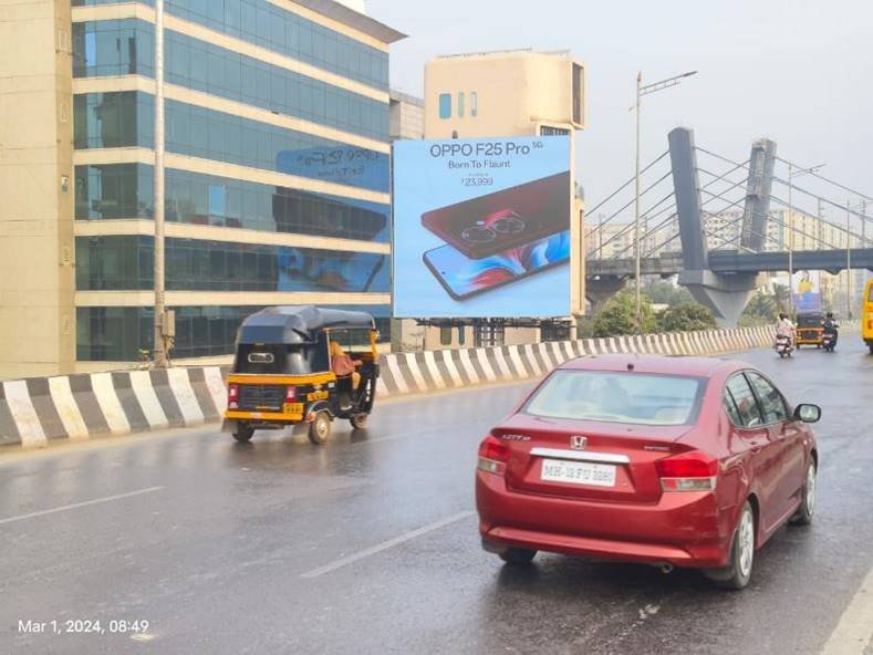 Street view of branded displays by leading Pole Kiosk Advertising Companies in Mumbai on a busy urban road with consistent foot and vehicle traffic Street view of branded displays by leading Pole Kiosk Advertising Companies in Mumbai on a busy urban road with consistent foot and vehicle traffic