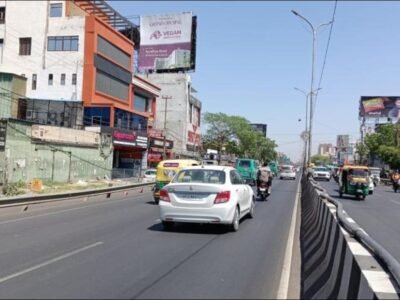 High-visibility hoarding on a busy road in Lucknow installed by ACME Advertising Co., a trusted leader in hoarding advertising companies in Lucknow.