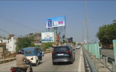 Roadside billboard in Lucknow displaying a ₹99 Hindi ad, placed by ACME Advertising Co., a leading name among billboard advertising companies in Lucknow.