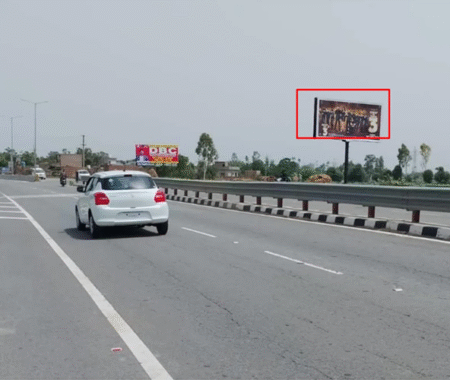 Sangrur Mehlan Road Flyover towards Delhi with 20x10 ft hoarding by ACME Advertising Co., featuring roadside billboard, white car, lane markings, barriers, and clear sky. png