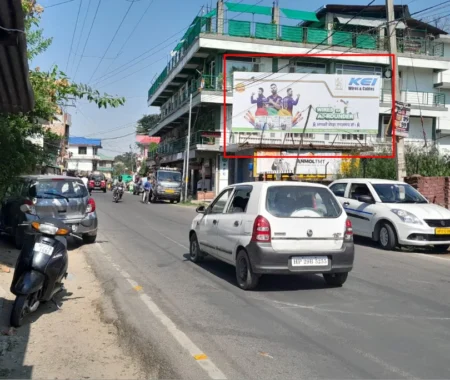 Urban street with 20x10 ft KEI Wires & Cables hoarding by ACME Advertising Co. in Himachal Pradesh, featuring Har Ghar Tiranga patriotic visual, moving vehicles, pedestrians, and multi story buildings