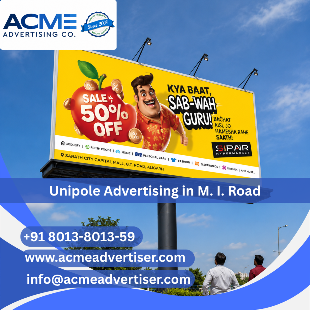 Premium unipole advertising display by ACME Advertising Co. on M. I. Road at a high-traffic commercial location.