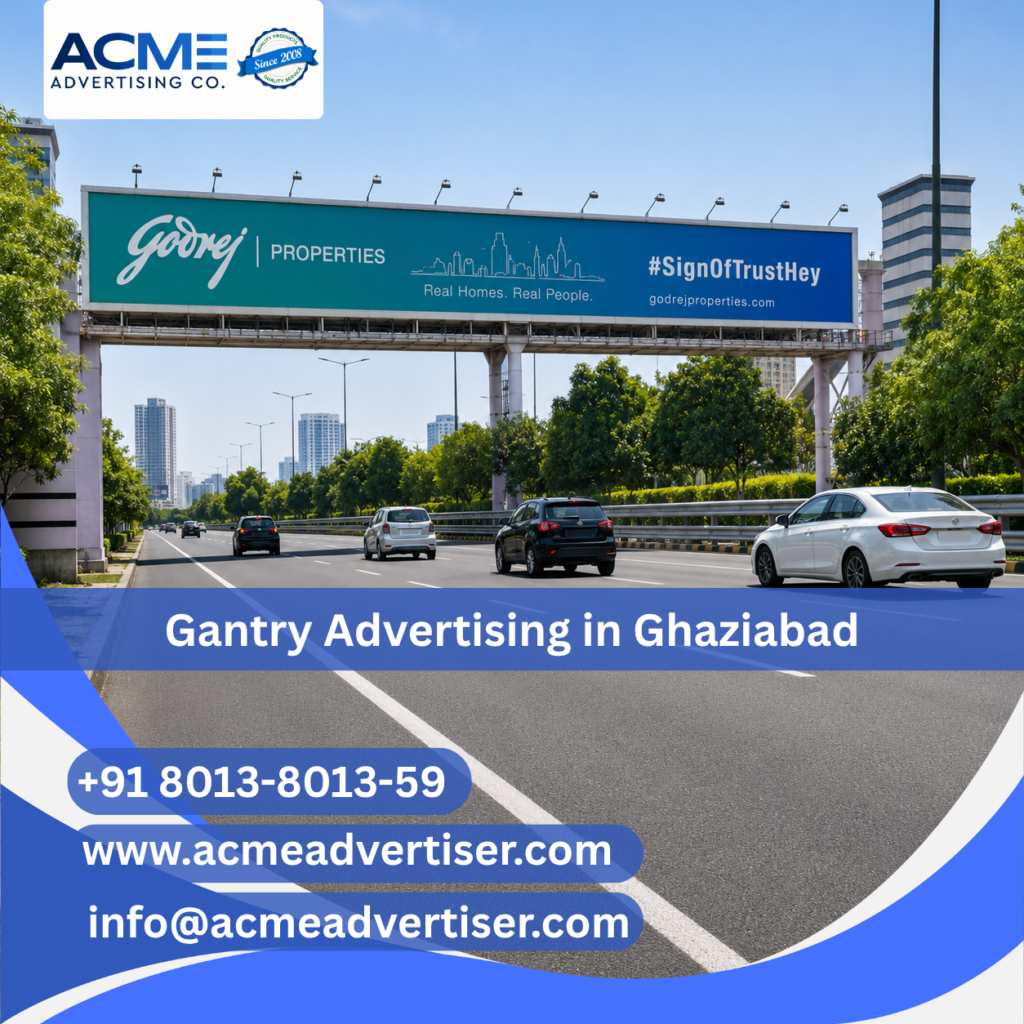 Large gantry advertising display by ACME Advertising Co. in Ghaziabad at a high-traffic highway and roadside location.