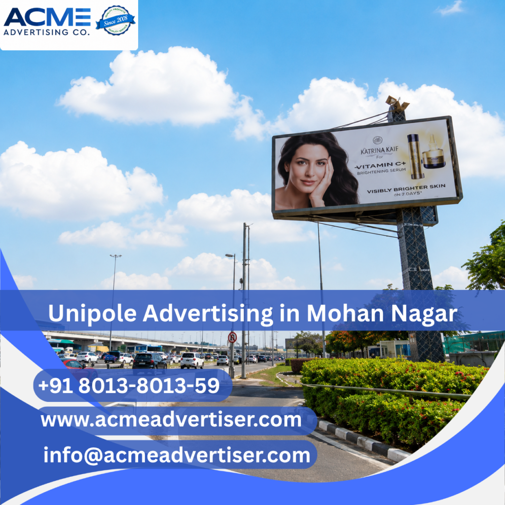High-visibility unipole advertising display by ACME Advertising Co. in Mohan Nagar at a prime roadside commercial location.