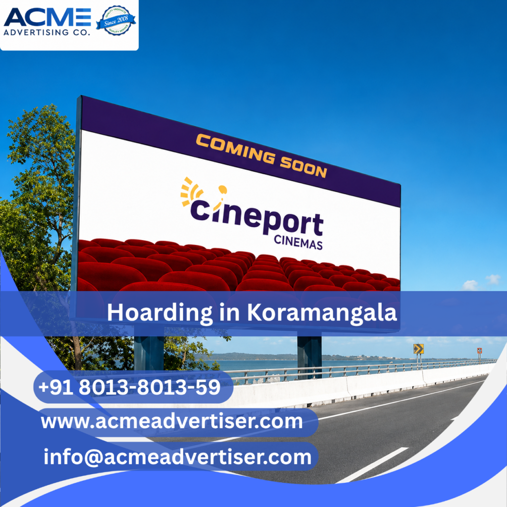 Large outdoor hoarding advertisement by ACME Advertising Co. in Koramangala at a prime high-traffic roadside location.