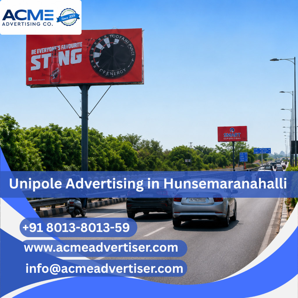 Large unipole advertising display by ACME Advertising Co. in Hunsemaranahalli at a high-traffic roadside location.