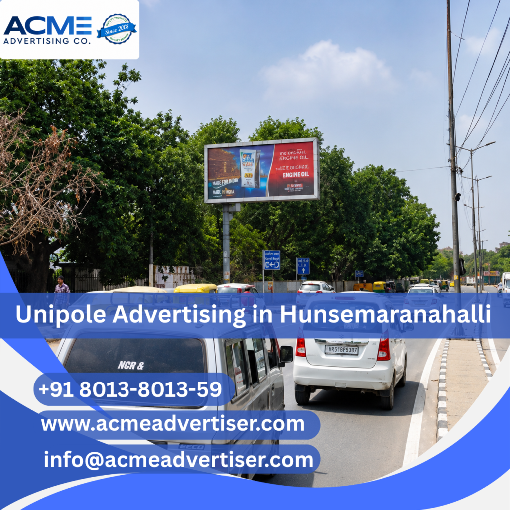 Large unipole advertising display by ACME Advertising Co. in Hunsemaranahalli at a high-traffic roadside location.