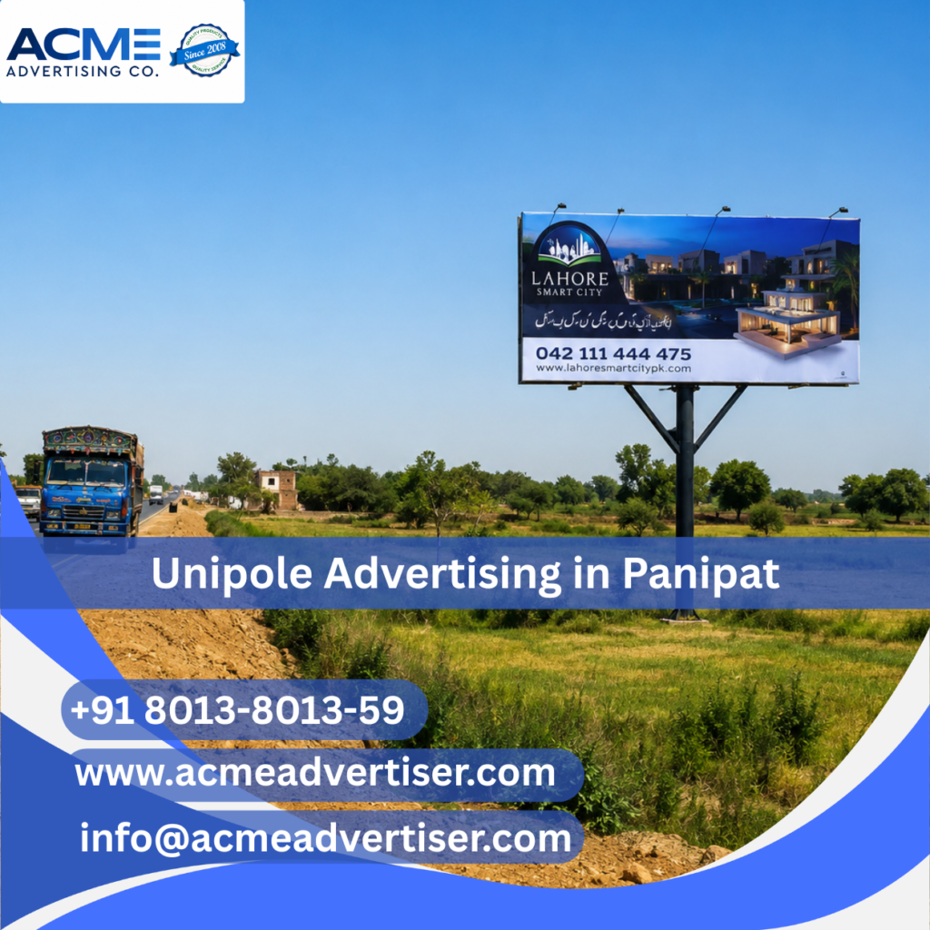 High-visibility unipole advertising display by ACME Advertising Co. in Panipat at a busy roadside commercial location.