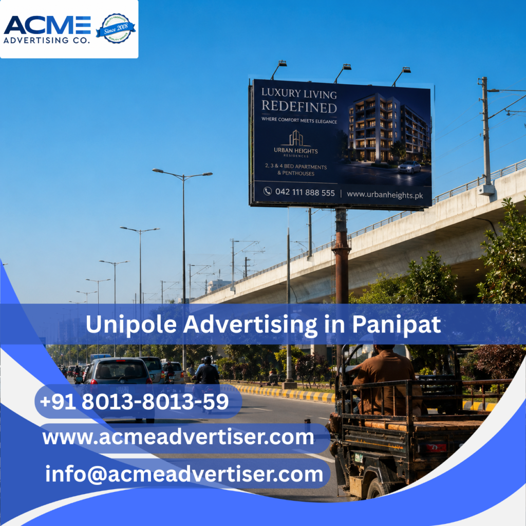 High-visibility unipole advertising display by ACME Advertising Co. in Panipat at a busy roadside commercial location.