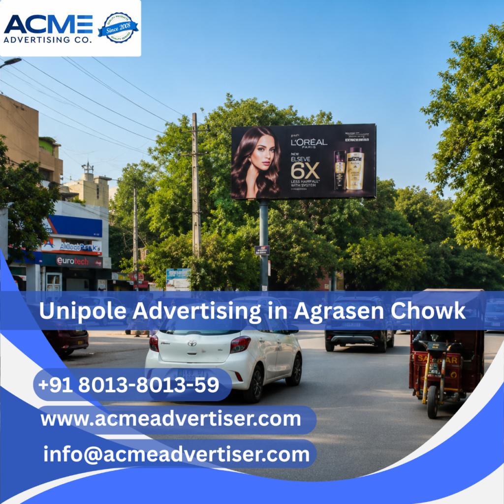 Large unipole advertising display by ACME Advertising Co. at Agrasen Chowk on a high-traffic roadside location.
