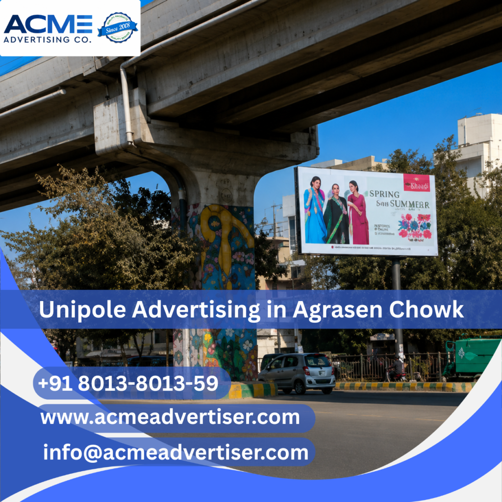 Large unipole advertising display by ACME Advertising Co. at Agrasen Chowk on a high-traffic roadside location.