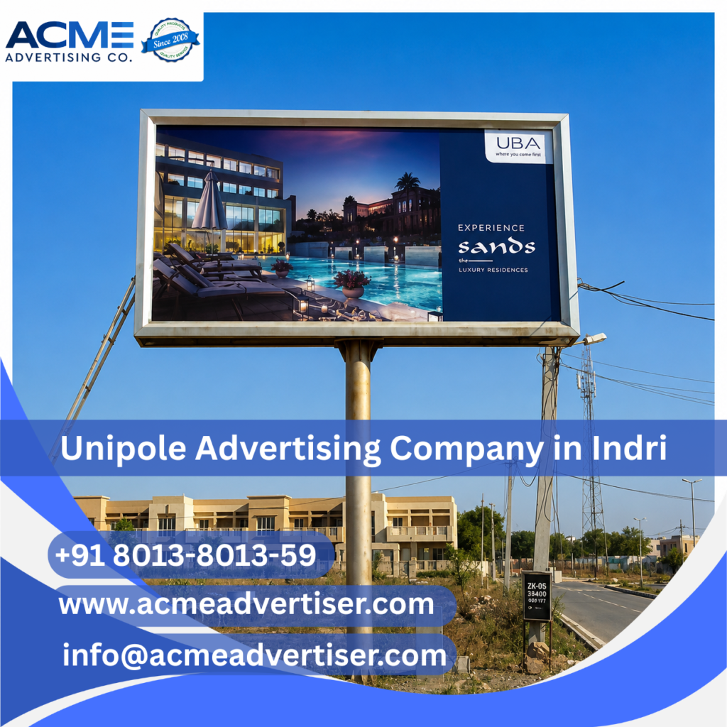 High-visibility unipole advertising display by ACME Advertising Co. near New Bus Stand Indri at a busy roadside location.