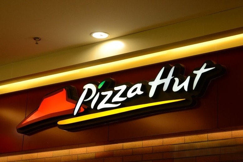 Pizza Hut illuminated storefront sign showcasing premium signages board advertising for restaurant branding