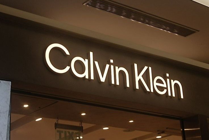Calvin Klein retail storefront featuring minimalist signages board advertising in a mall environment