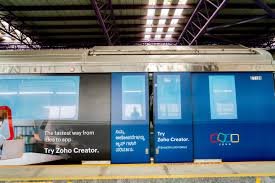 Metro train exterior advertising at Kirti Nagar - 