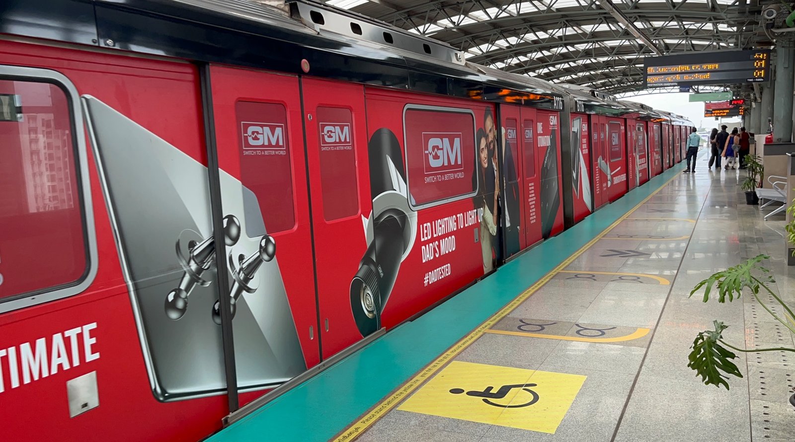 Metro train wrap advertising at Ghevra station - 